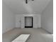 This bedroom features neutral carpeting, two windows providing natural light, and a modern ceiling fan at 2272 Misty Brook Ct, Buford, GA 30519
