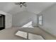 This bedroom features neutral carpeting, one window providing natural light, and a modern ceiling fan at 2272 Misty Brook Ct, Buford, GA 30519