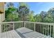 Home's exterior deck with wooded views at 2272 Misty Brook Ct, Buford, GA 30519