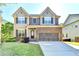Beautiful two-story home with a well-maintained lawn, showcasing a welcoming exterior at 2272 Misty Brook Ct, Buford, GA 30519