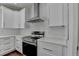 Bright kitchen features a stainless steel range and white quartz countertops at 2272 Misty Brook Ct, Buford, GA 30519