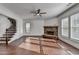 Living room boasts hardwood floors, stone fireplace, and an elegant staircase at 2272 Misty Brook Ct, Buford, GA 30519