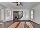 Inviting living room featuring hardwood floors, a staircase, and an open layout at 2272 Misty Brook Ct, Buford, GA 30519