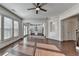 Bright living room with hardwood floors and views of the kitchen at 2272 Misty Brook Ct, Buford, GA 30519