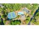 Aerial photo highlighting community tennis courts, pool, clubhouse, and parking area at 415 Oak Laurel Ct, Johns Creek, GA 30022