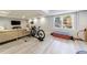 Open basement space with a sectional sofa, a window and exercise equipment at 415 Oak Laurel Ct, Johns Creek, GA 30022