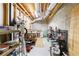 Unfinished basement featuring exposed ductwork and lighting, and offering ample storage space on metal shelving units at 415 Oak Laurel Ct, Johns Creek, GA 30022