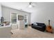 Minimalist bedroom with a large window, white walls, and neutral carpet at 415 Oak Laurel Ct, Johns Creek, GA 30022