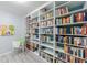 Built in bookshelves lining the walls, with room for reading and studying at 415 Oak Laurel Ct, Johns Creek, GA 30022