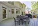Spacious outdoor deck featuring a dining table and grill, perfect for entertaining and outdoor gatherings at 415 Oak Laurel Ct, Johns Creek, GA 30022