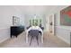Elegant dining room featuring modern furniture and ample natural light at 415 Oak Laurel Ct, Johns Creek, GA 30022
