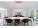 Modern dining room with stylish lighting and large windows at 415 Oak Laurel Ct, Johns Creek, GA 30022