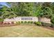 Stone entrance to Fox Creek community with manicured landscaping at 415 Oak Laurel Ct, Johns Creek, GA 30022