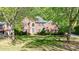 Charming brick home featuring lush greenery and a well-maintained front lawn at 415 Oak Laurel Ct, Johns Creek, GA 30022