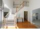 Bright foyer with hardwood floors, staircase, and soaring ceilings at 415 Oak Laurel Ct, Johns Creek, GA 30022