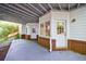 Covered outdoor patio area with access to the home's lower level at 415 Oak Laurel Ct, Johns Creek, GA 30022