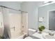 Bathroom with shower-tub combo, toilet, and vanity with sink at 5640 Rolling Oaks Dr, Cumming, GA 30040