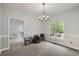 Bright bedroom with natural light, neutral walls, and adjacent loft at 5640 Rolling Oaks Dr, Cumming, GA 30040