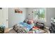 Bright bedroom with carpet, a window, and playful decor at 5640 Rolling Oaks Dr, Cumming, GA 30040