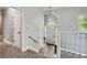 Bright foyer with tile flooring, and staircase to the second story at 5640 Rolling Oaks Dr, Cumming, GA 30040