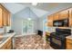 Contemporary kitchen with a range, stainless steel appliances, granite countertops, and chic flooring at 5640 Rolling Oaks Dr, Cumming, GA 30040