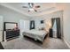 Spacious main bedroom with tray ceiling, soft carpet, and neutral color palette at 5640 Rolling Oaks Dr, Cumming, GA 30040
