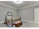 Cozy bedroom featuring a traditional four-poster bed, soft carpet and neutral color palette at 6050 Eagle Close Ln, Sugar Hill, GA 30518