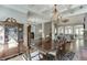 Stately dining room with coffered ceilings, chandelier, adjacent to living spaces for easy entertaining at 6050 Eagle Close Ln, Sugar Hill, GA 30518
