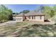 Beautiful brick home with a three-car garage and well-maintained lawn at 6050 Eagle Close Ln, Sugar Hill, GA 30518