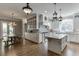 Modern kitchen with granite countertops, stainless steel appliances, and a center island at 6050 Eagle Close Ln, Sugar Hill, GA 30518