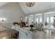 Spacious living room with hardwood floors, high ceilings, and arched doorways leading to other areas of the home at 6050 Eagle Close Ln, Sugar Hill, GA 30518