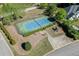 Aerial shot of a well-maintained tennis court next to playground at 6050 Eagle Close Ln, Sugar Hill, GA 30518