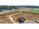 Community aerial view of a neighborhood with tennis courts, soccer fields, walking paths, and ample parking at 6680 Benchwood Path, Cumming, GA 30028