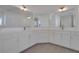 A bright bathroom featuring an oversized double vanity and modern fixtures at 6680 Benchwood Path, Cumming, GA 30028
