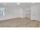 Bright bedroom with light wood flooring, recessed lights and bright white walls and trim at 6680 Benchwood Path, Cumming, GA 30028