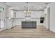 Modern kitchen with custom island, stainless appliances, and ample cabinet space at 6680 Benchwood Path, Cumming, GA 30028