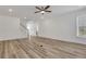 Open and airy living room with staircase, and light neutral flooring at 6680 Benchwood Path, Cumming, GA 30028