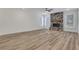 Bright living room with a stone fireplace and ample space for entertaining at 6680 Benchwood Path, Cumming, GA 30028