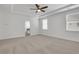 Bright and open main bedroom with two windows and an en suite bath at 6680 Benchwood Path, Cumming, GA 30028