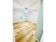 A bedroom featuring wood flooring, a window, and an updated ceiling fan at 7675 Lanier View Rdg, Cumming, GA 30041