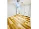 This bedroom features gorgeous wood flooring and an updated ceiling fan at 7675 Lanier View Rdg, Cumming, GA 30041