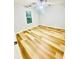 Bedroom features a ceiling fan, a window, and wood-look flooring at 7675 Lanier View Rdg, Cumming, GA 30041