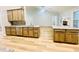 Bright kitchen featuring custom cabinets, modern appliances, and a lovely granite countertop island and backsplash at 7675 Lanier View Rdg, Cumming, GA 30041