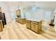 Spacious kitchen features an island with granite countertop, modern appliances and lots of natural light at 7675 Lanier View Rdg, Cumming, GA 30041