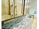 Close up on the custom cabinets, backsplash, granite countertops and modern fixtures in the bright kitchen at 7675 Lanier View Rdg, Cumming, GA 30041
