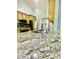 Close-up view of kitchen island featuring a granite countertop and stainless steel faucet at 7675 Lanier View Rdg, Cumming, GA 30041