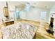Open concept living room with a granite countertop kitchen island and fireplace at 7675 Lanier View Rdg, Cumming, GA 30041