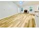 Living room featuring hardwood floors, fireplace, and natural light at 7675 Lanier View Rdg, Cumming, GA 30041