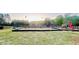 Community playground with slides, swings, and sports court offers outdoor recreation opportunities at 7675 Lanier View Rdg, Cumming, GA 30041
