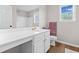 Bathroom includes a large sink, toilet, and shower with a vanity mirror at 3317 Ridgemill Cir, Dacula, GA 30019